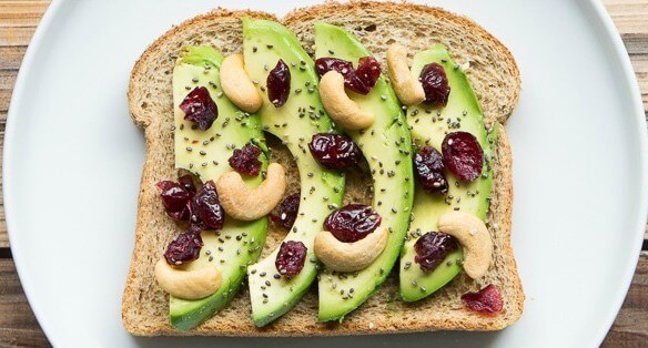 Avocado toast with cashews, craisins, and chia seeds